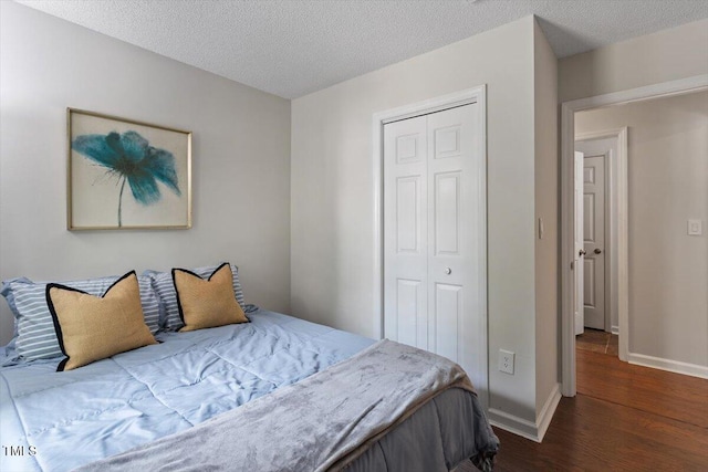 1 Old Towne Pl, Durham, NC 27713 - bedroom with wood finished floors, a closet, baseboards, and a textured ceiling