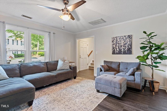 1 Old Towne Pl, Durham, NC 27713 - living room with dark wood-type flooring, stairway, ceiling fan, crown molding, and a textured ceiling