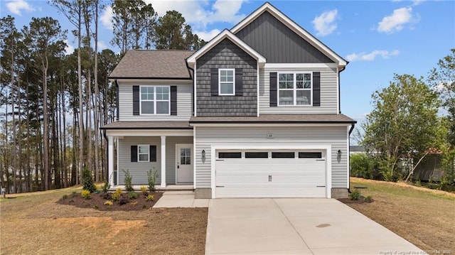 60 Bennett Rd, Coats, NC 27521 - craftsman-style home featuring a porch, driveway, an attached garage, and a front lawn