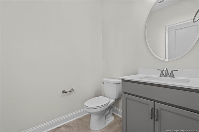 60 Bennett Rd, Coats, NC 27521 - bathroom featuring baseboards, vanity, toilet, and tile patterned floors