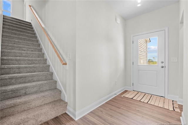 60 Bennett Rd, Coats, NC 27521 - entrance foyer with wood finished floors, stairs, and baseboards