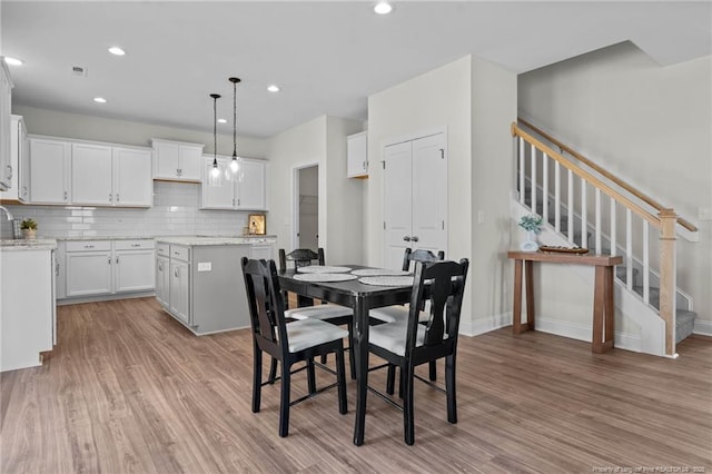 60 Bennett Rd, Coats, NC 27521 - dining area with light wood-style flooring, stairway, baseboards, and recessed lighting