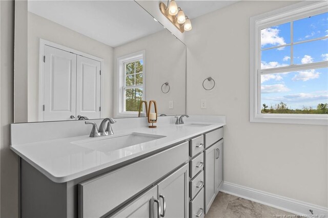 60 Bennett Rd, Coats, NC 27521 - full bathroom featuring double vanity and baseboards