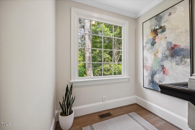 2725 Rosedale Ave, Raleigh, NC 27607 - detailed view of baseboards, wood finished floors, and ornamental molding