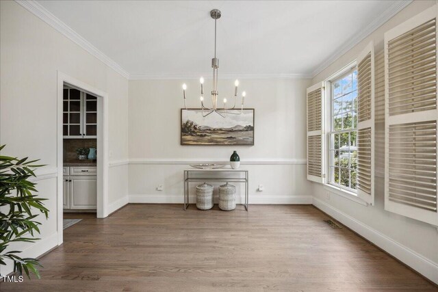 2725 Rosedale Ave, Raleigh, NC 27607 - unfurnished dining area with a chandelier, dark wood finished floors, crown molding, and baseboards