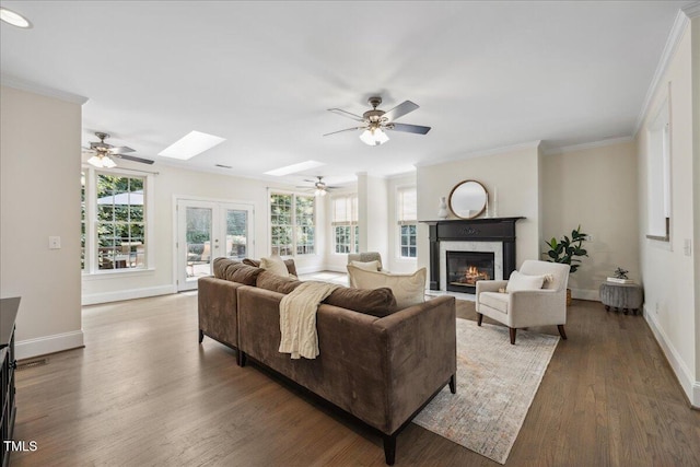 2725 Rosedale Ave, Raleigh, NC 27607 - living room with a glass covered fireplace, ceiling fan, baseboards, and crown molding