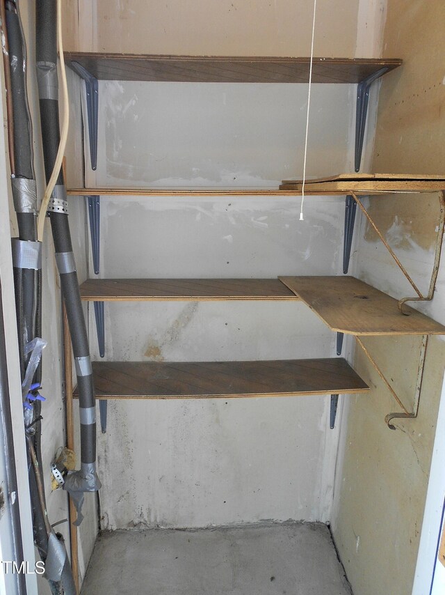 1402 Barton Place Dr, Raleigh, NC 27608 - stairs featuring unfinished concrete flooring