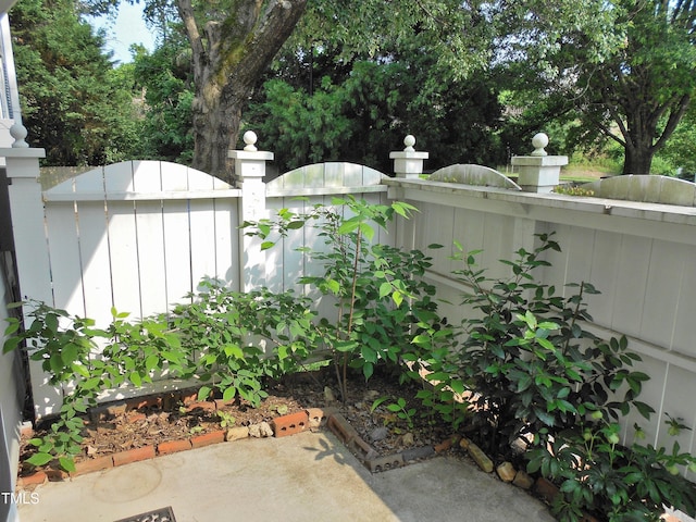 1402 Barton Place Dr, Raleigh, NC 27608 - view of patio featuring a fenced front yard and a gate