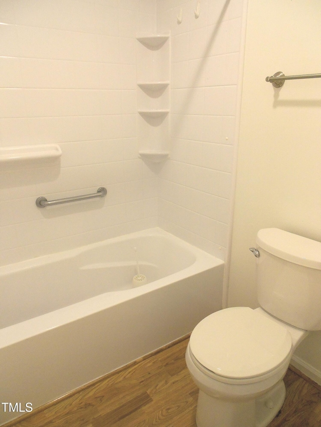 1402 Barton Place Dr, Raleigh, NC 27608 - bathroom featuring wood finished floors, toilet, and washtub / shower combination