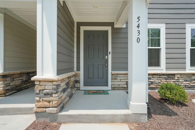 5430 Crescent Square St, Raleigh, NC 27616 - entrance to property featuring stone siding and covered porch