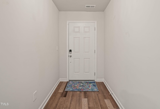 5430 Crescent Square St, Raleigh, NC 27616 - doorway with wood finished floors and baseboards