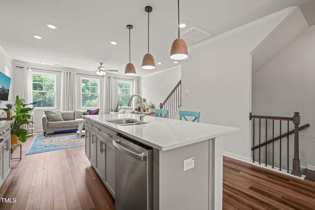 5430 Crescent Square St, Raleigh, NC 27616 - kitchen featuring stainless steel dishwasher, a sink, ornamental molding, gray cabinets, and dark wood-type flooring