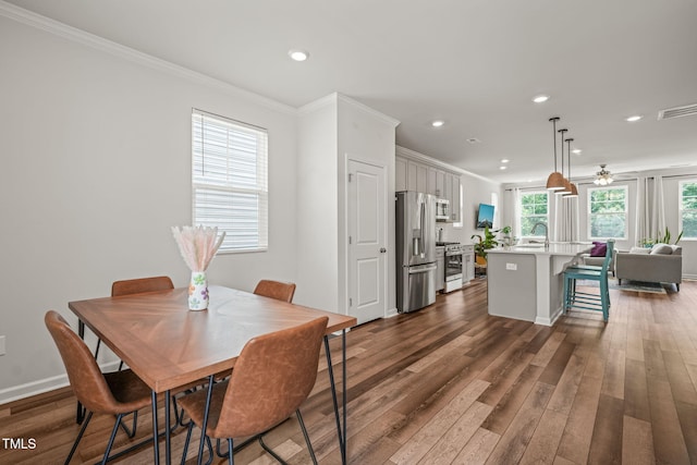 5430 Crescent Square St, Raleigh, NC 27616 - dining space with crown molding, dark wood-type flooring, recessed lighting, a ceiling fan, and baseboards