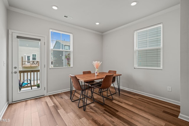 5430 Crescent Square St, Raleigh, NC 27616 - dining space with wood-type flooring, crown molding, baseboards, and recessed lighting