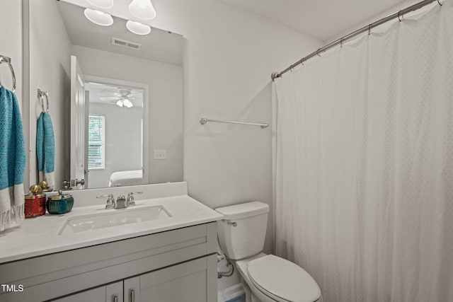 5430 Crescent Square St, Raleigh, NC 27616 - bathroom with toilet, vanity, a ceiling fan, and curtained shower