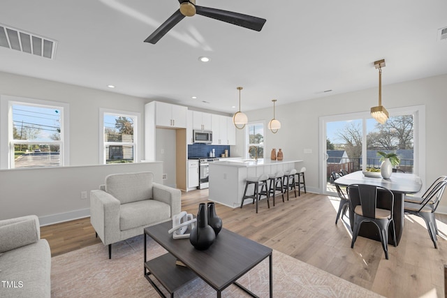 517 Coleman St, Raleigh, NC 27610 - living room with baseboards, light wood-style flooring, recessed lighting, and ceiling fan
