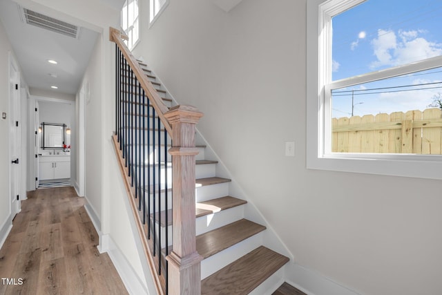 517 Coleman St, Raleigh, NC 27610 - stairs with wood finished floors, recessed lighting, and baseboards