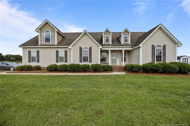 140 Bagley Ln, Dunn, NC 28334 - cape cod home with a front lawn, a porch, and roof with shingles