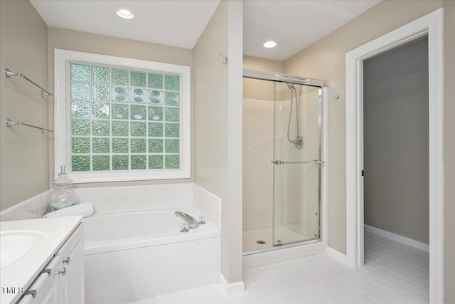 904 Oldwyck Dr, Fuquay Varina, NC 27526 - bathroom with a stall shower, a garden tub, vanity, and tile patterned floors