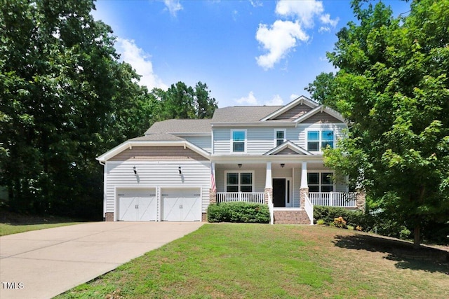 1304 Double Oak Ln, Willow Springs, NC 27592 - craftsman inspired home with covered porch, an attached garage, concrete driveway, a front lawn, and a shingled roof