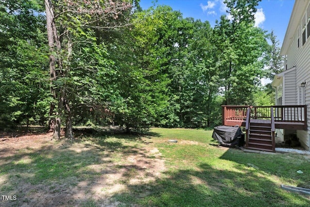 1304 Double Oak Ln, Willow Springs, NC 27592 - view of grassy yard featuring a deck