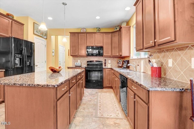1304 Double Oak Ln, Willow Springs, NC 27592 - kitchen featuring black appliances, a sink, a center island, brown cabinetry, and recessed lighting