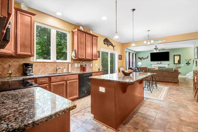 1304 Double Oak Ln, Willow Springs, NC 27592 - kitchen with black dishwasher, a sink, decorative backsplash, a center island, and open floor plan