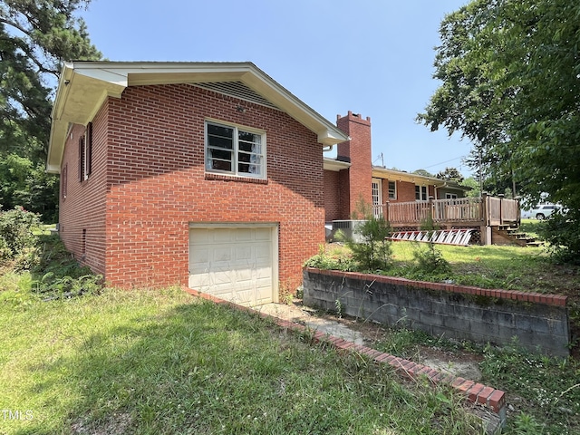 2433 Zacks Mill Rd, Angier, NC 27501 - view of front of house featuring brick siding, a garage, a deck, a front lawn, and a chimney