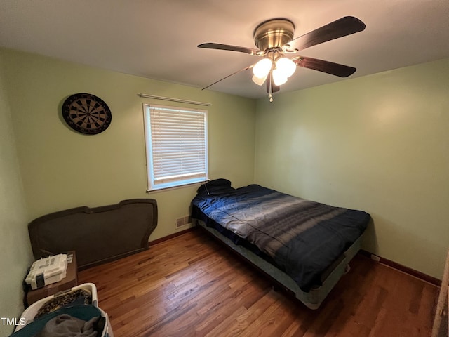 2433 Zacks Mill Rd, Angier, NC 27501 - bedroom with wood finished floors, baseboards, and a ceiling fan