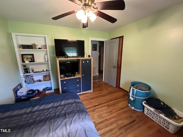 2433 Zacks Mill Rd, Angier, NC 27501 - bedroom featuring light wood-type flooring and ceiling fan