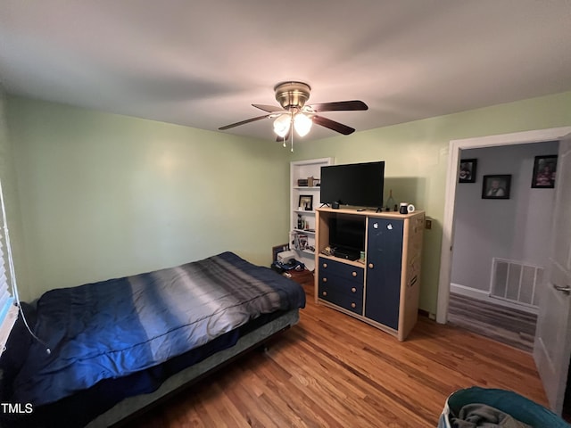 2433 Zacks Mill Rd, Angier, NC 27501 - bedroom featuring light wood-style floors and ceiling fan