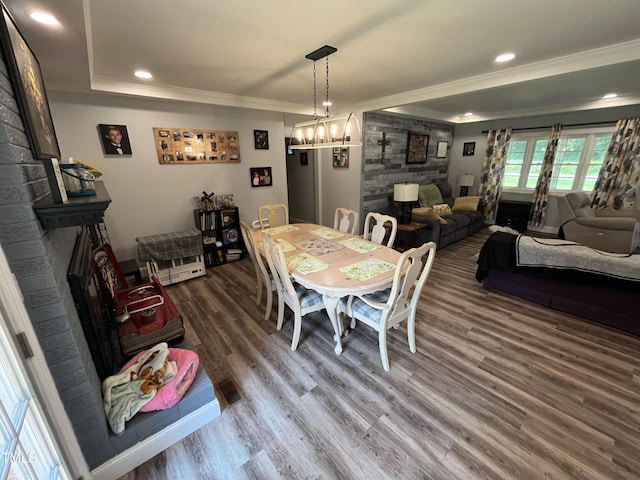 2433 Zacks Mill Rd, Angier, NC 27501 - dining area featuring crown molding, a large fireplace, wood finished floors, recessed lighting, and a chandelier