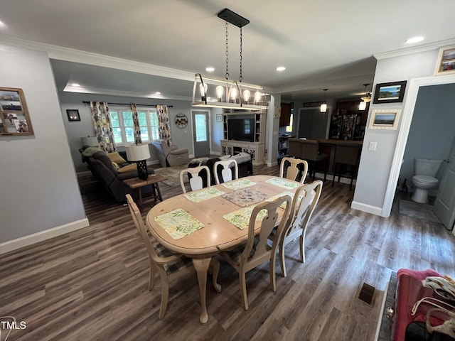 2433 Zacks Mill Rd, Angier, NC 27501 - dining area featuring ornamental molding, wood finished floors, baseboards, and recessed lighting