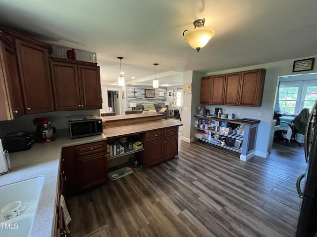 2433 Zacks Mill Rd, Angier, NC 27501 - kitchen featuring black microwave, dark wood-type flooring, light countertops, and a peninsula