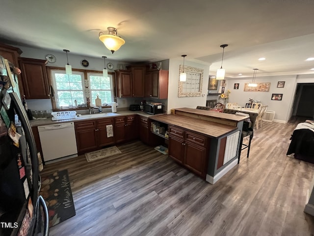 2433 Zacks Mill Rd, Angier, NC 27501 - kitchen with white dishwasher, black microwave, freestanding refrigerator, dark wood-style floors, and recessed lighting