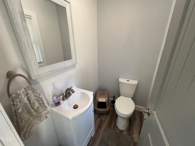 2433 Zacks Mill Rd, Angier, NC 27501 - bathroom featuring wood finished floors, toilet, and vanity