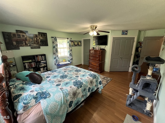 2433 Zacks Mill Rd, Angier, NC 27501 - bedroom featuring wood finished floors, a ceiling fan, and a textured ceiling