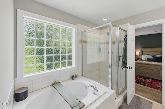 2933 Creek Moss Ave, Wake Forest, NC 27587 - ensuite bathroom with a bath, a shower stall, and healthy amount of natural light