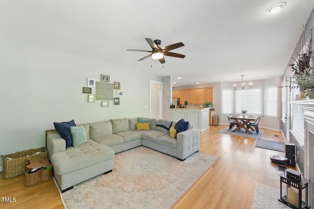 2933 Creek Moss Ave, Wake Forest, NC 27587 - living area with a chandelier, light wood-style floors, a ceiling fan, and recessed lighting