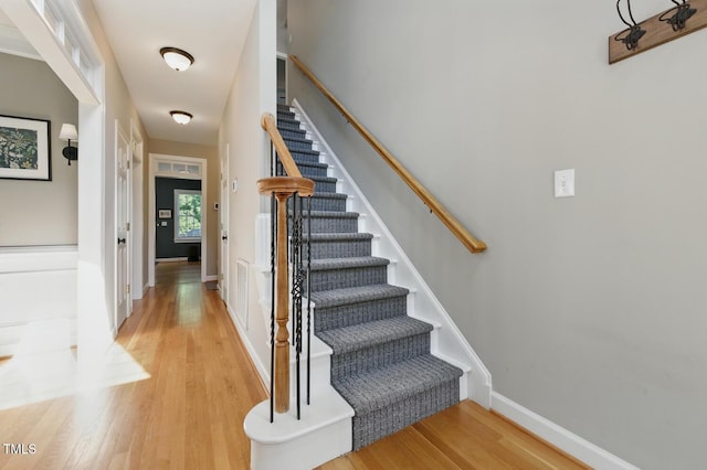 2933 Creek Moss Ave, Wake Forest, NC 27587 - stairs with wood finished floors and baseboards