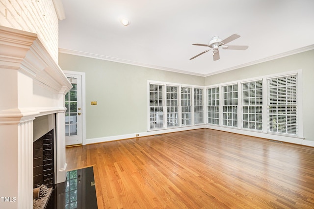 7605 Sandy Lake Ct, Raleigh, NC 27613 - unfurnished living room with a ceiling fan, wood finished floors, crown molding, and a fireplace with flush hearth