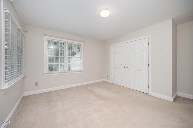 7605 Sandy Lake Ct, Raleigh, NC 27613 - unfurnished bedroom with carpet and a closet