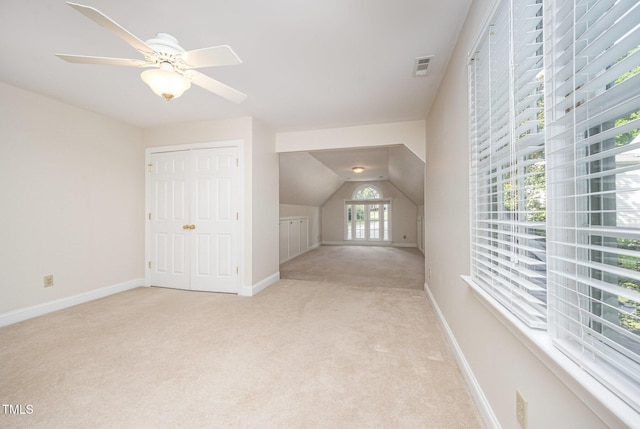 7605 Sandy Lake Ct, Raleigh, NC 27613 - bonus room featuring light colored carpet, ceiling fan, and vaulted ceiling