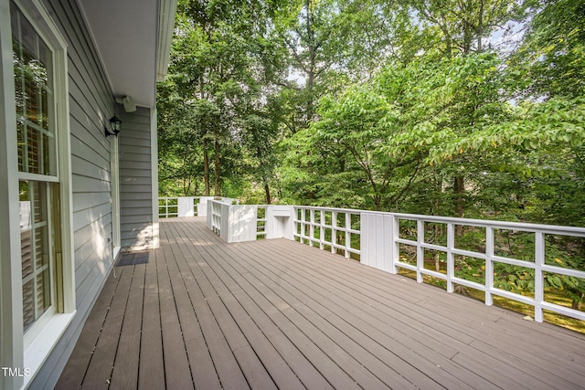 7605 Sandy Lake Ct, Raleigh, NC 27613 - wooden terrace featuring view of wooded area