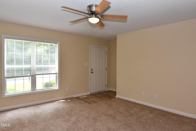 5949 Sandy Run, Knightdale, NC 27545 - spare room with carpet, baseboards, and a ceiling fan