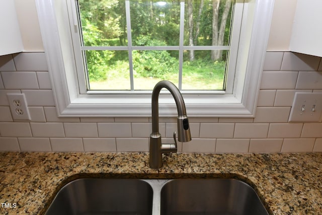 5949 Sandy Run, Knightdale, NC 27545 - kitchen view of a sink, stone countertops, and tasteful backsplash