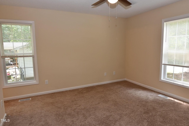 5949 Sandy Run, Knightdale, NC 27545 - carpeted spare room featuring ceiling fan, plenty of natural light, and baseboards
