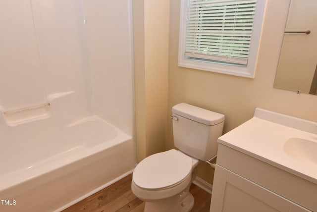 5949 Sandy Run, Knightdale, NC 27545 - bathroom featuring wood finished floors, vanity, toilet, baseboards, and shower / bathtub combination