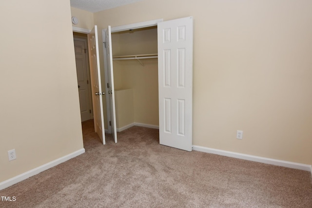 5949 Sandy Run, Knightdale, NC 27545 - unfurnished bedroom with carpet floors, a closet, and baseboards