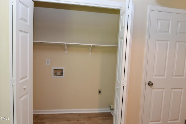 5949 Sandy Run, Knightdale, NC 27545 - washroom featuring hookup for an electric dryer, wood finished floors, baseboards, and hookup for a washing machine